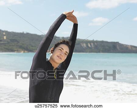 "Surfer stretching on beach, Roadknight, Victoria, Australia" View Large Photo Image Stock Photography - "Surfer stretching on beach, Roadknight, Victoria, Australia". Fotosearch