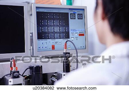 Technician working in LED factory View Large Photo Image Stock Image - Technician working in LED factory. Fotosearch