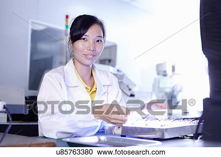 Technician working in LED factory View Large Photo Image Stock Image - Technician working in LED factory. Fotosearch
