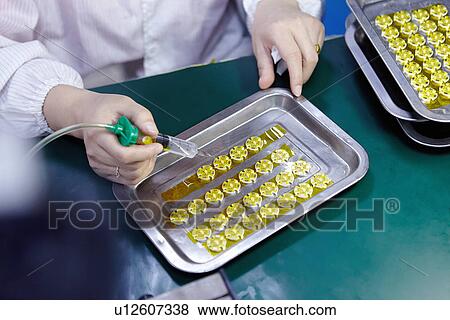 Technician working in LED factory View Large Photo Image Stock Photo - Technician working in LED factory. Fotosearch