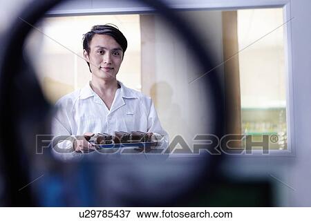 Technician working in LED factory View Large Photo Image Stock Photo - Technician working in LED factory. Fotosearch