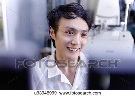 Technician working in LED factory View Large Photo Image Stock Photo - Technician working in LED factory. Fotosearch
