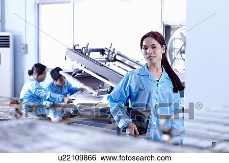 Stock Photograph - Technician working in LED factory. Fotosearch