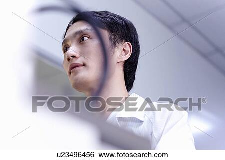 Stock Photograph - Technician working in LED factory. Fotosearch
