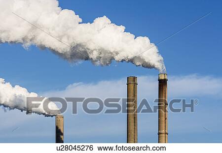 Top of smoke stacks with blue sky View Large Photo Image Stock Photograph - Top of smoke stacks with blue sky. Fotosearch