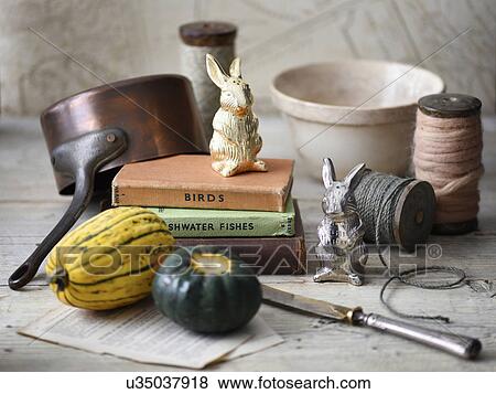 "Vegetables, books, rabbit figurines, string, pot" View Large Photo Image Stock Photo - "Vegetables, books, rabbit figurines, string, pot". Fotosearch