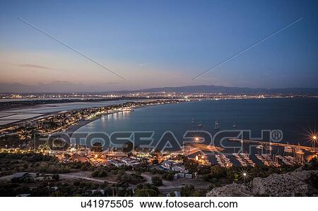Stock Photography - "View of coast at sunset, Cagliari, Sardinia, Italy". Fotosearch