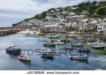 "View of fishing boats and harbor, Mousehole, Cornwall, UK" View Large Photo Image Stock Photograph - "View of fishing boats and harbor, Mousehole, Cornwall, UK". Fotosearch