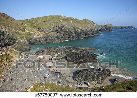 "View of holiday makers on beach, Kynance Cove, Cornwall, UK" View Large Photo Image Stock Photo - "View of holiday makers on beach, Kynance Cove, Cornwall, UK". Fotosearch