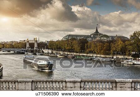 "View of river Seine with the Grand Palace in distance, Paris, France" View Large Photo Image Stock Image - "View of river Seine with the Grand Palace in distance, Paris, France". Fotosearch