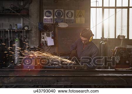 Welder cutting iron in workshop View Large Photo Image Stock Image - Welder cutting iron in workshop. Fotosearch