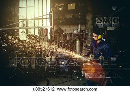 Welder cutting iron in workshop View Large Photo Image Stock Image - Welder cutting iron in workshop. Fotosearch