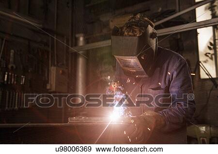Stock Photo - Welder soldering iron in workshop. Fotosearch