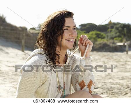 Stock Photo - "Woman enjoying beach, Roadknight, Victoria, Australia". Fotosearch