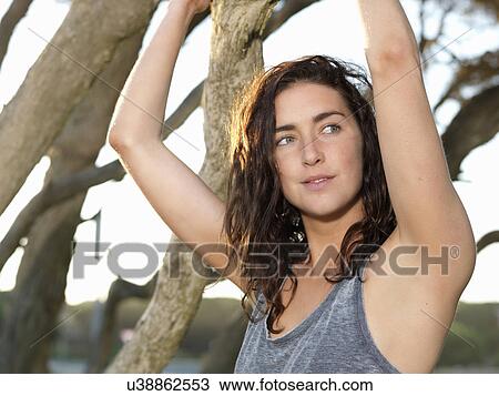 "Woman relaxing by trees, Roadknight, Victoria, Australia" View Large Photo Image Stock Image - "Woman relaxing by trees, Roadknight, Victoria, Australia". Fotosearch