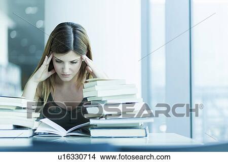 Woman studying in the library View Large Photo Image Picture - Woman studying in the library. Fotosearch