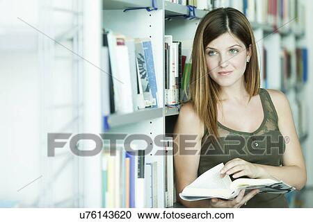 Woman studying in the library View Large Photo Image Stock Image - Woman studying in the library. Fotosearch