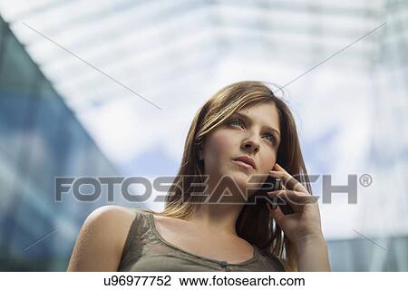 Woman using phone View Large Photo Image Stock Image - Woman using phone. Fotosearch
