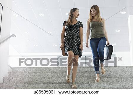 Women walking down stairs View Large Photo Image Stock Image - Women walking down stairs. Fotosearch