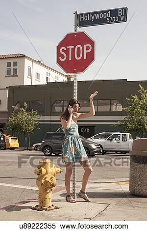 "Young woman in street, talking angrily on mobile phone" View Large Photo Image Stock Photography - "Young woman in street, talking angrily on mobile phone". Fotosearch