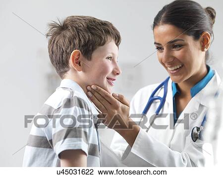 Stock Image - Paediatric examination. Fotosearch