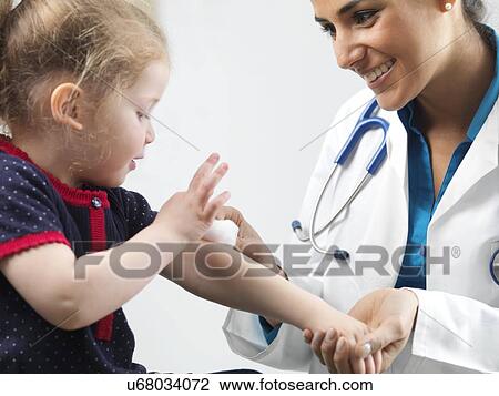 Stock Image - Paediatric examination. Fotosearch