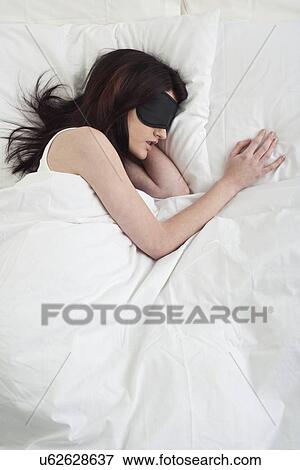 Young woman sleeping View Large Photo Image Stock Photo - Young woman sleeping. Fotosearch