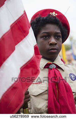 "African American Boyscout display US Flag at solemn 2014 Memorial Day Event, Los Angeles National Cemetery, California, USA" View Large Photo Image Stock Photo - "African American Boyscout display US Flag at solemn 2014 Memorial Day Event, Los Angeles National Cemetery, California, USA". Fotosearch