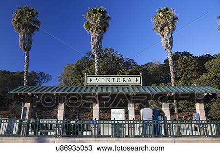 Stock Image - "Amtrak train stop with three palm trees, Ventura, California, USA". Fotosearch