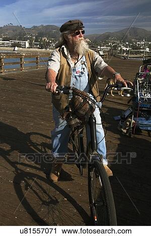 "Beareded man on bicycle looks towards Pacific Ocean, Ventura Pier, Ventura, California, USA" View Large Photo Image Stock Image - "Beareded man on bicycle looks towards Pacific Ocean, Ventura Pier, Ventura, California, USA". Fotosearch