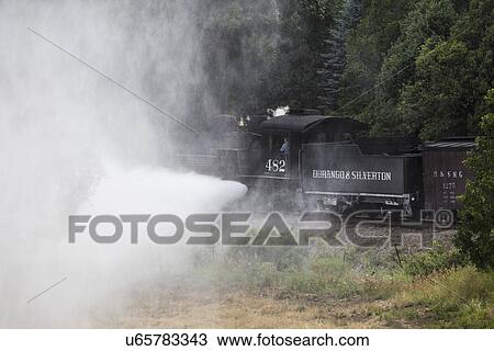 Stock Image - "Blowing Steam, Durango and Silverton Narrow Gauge Railroad Steam Engine train, Durango, Colorado, USA". Fotosearch
