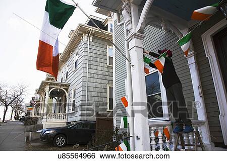 Stock Photograph - "Boy displays Irish flag, St. Patrick's Day Parade, 2014, South Boston, Massachusetts, USA". Fotosearch