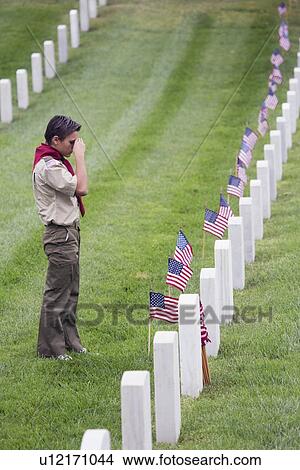 Picture - "Boyscout places one of 85, 000 US Flags at 2014 Memorial Day Event, Los Angeles National Cemetery, California, USA". Fotosearch