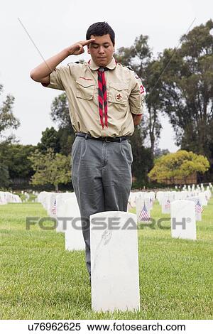 Stock Photography - "Boyscout saluting at one of 85, 000 US Flags at Annual Memorial Day Event, Los Angeles National Cemetery, California, USA". Fotosearch