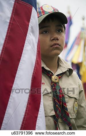 Stock Photograph - "Boyscouts display US Flag at solemn 2014 Memorial Day Event, Los Angeles National Cemetery, California, USA". Fotosearch