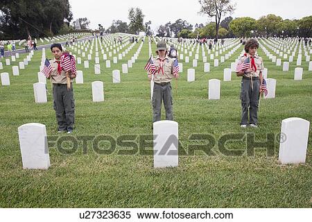 Stock Photography - "Boyscouts place one of 85, 000 US Flags at 2014 Memorial Day Event, Los Angeles National Cemetery, California, USA". Fotosearch