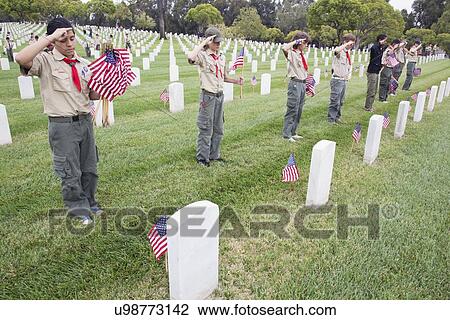 Stock Image - "Boyscouts saluting at one of 85, 000 US Flags at 2014 Memorial Day Event, Los Angeles National Cemetery, California, USA". Fotosearch