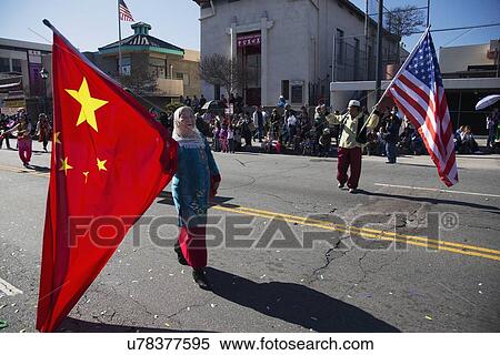 Stock Photography - "Chinese and U. S. flags at Chinese New Year parade, 2014, Year of the Horse, Los Angeles, California, USA". Fotosearch