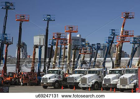 "Colorful cherry pickers in Boston, Massachusetts, USA" View Large Photo Image Stock Image - "Colorful cherry pickers in Boston, Massachusetts, USA". Fotosearch