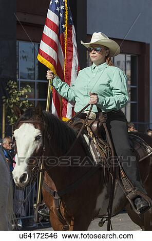 Stock Photograph - "Cowboys and girls, 115th Golden Dragon Parade, Chinese New Year, 2014, Year of the Horse, Los Angeles, California, USA". Fotosearch