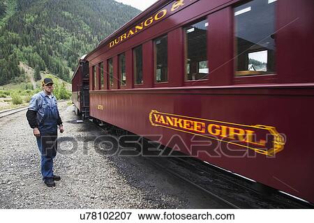 Stock Photo - "Crew on Durango and Silverton Narrow Gauge Railroad, Silverton, Colorado, USA". Fotosearch