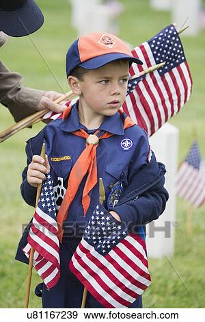 "Cubscout places one of 85, 000 US Flags at 2014 Memorial Day Event, Los Angeles National Cemetery, California, USA" View Large Photo Image Stock Photo - "Cubscout places one of 85, 000 US Flags at 2014 Memorial Day Event, Los Angeles National Cemetery, California, USA". Fotosearch