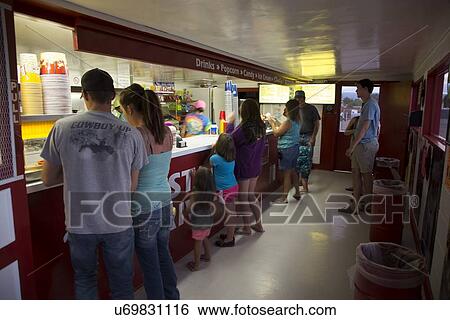 Stock Photograph - "Customers at Candy Counter, Star Drive In Movie Theater, Montrose, Colorado, USA". Fotosearch