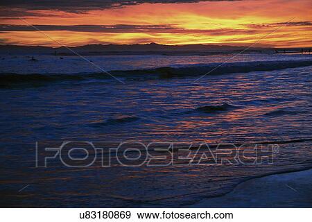 Stock Photo - "Deep purple and orange sunset looking towards Anacapa Island, Ventura, California, USA". Fotosearch