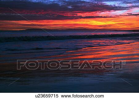Stock Photography - "Deep purple and orange sunset looking towards Anacapa Island, Ventura, California, USA". Fotosearch