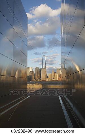 "Empty Sky: Jersey City 9/11 Memorial at sunset shows One World Trade Center (1WTC), Freedom Tower, New Jersey, USA" View Large Photo Image Stock Photograph - "Empty Sky: Jersey City 9/11 Memorial at sunset shows One World Trade Center (1WTC), Freedom Tower, New Jersey, USA". Fotosearch