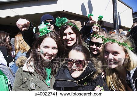 Stock Image - "Enthusiastic female crowd, St. Patrick's Day Parade, 2014, South Boston, Massachusetts, USA". Fotosearch