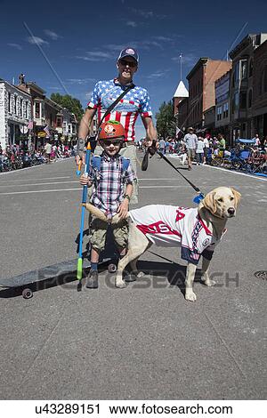 "Father, son and dog celebrate July 4, Independence Day Parade, Telluride, Colorado, USA" View Large Photo Image Stock Image - "Father, son and dog celebrate July 4, Independence Day Parade, Telluride, Colorado, USA". Fotosearch
