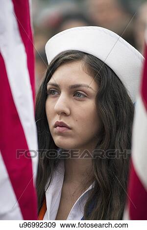 Stock Photo - "Girl with Navy Hat and US Flags at 2014 Memorial Day Event, Los Angeles National Cemetery, California, USA". Fotosearch