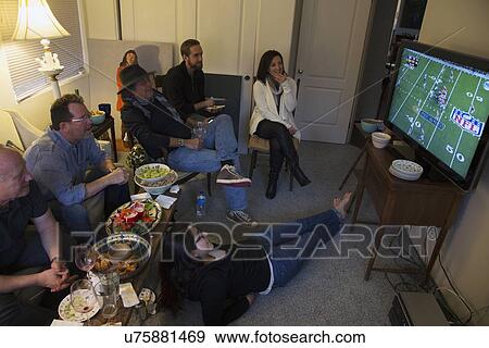"Group of people watch NFL Superbowl XLVIII on television, Feb. 2, 2014, Denver Broncos vs. Seattle Seahwaks" View Large Photo Image Stock Photo - "Group of people watch NFL Superbowl XLVIII on television, Feb. 2, 2014, Denver Broncos vs. Seattle Seahwaks". Fotosearch